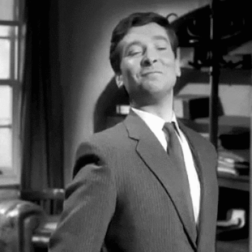 Kenneth Williams looking smug